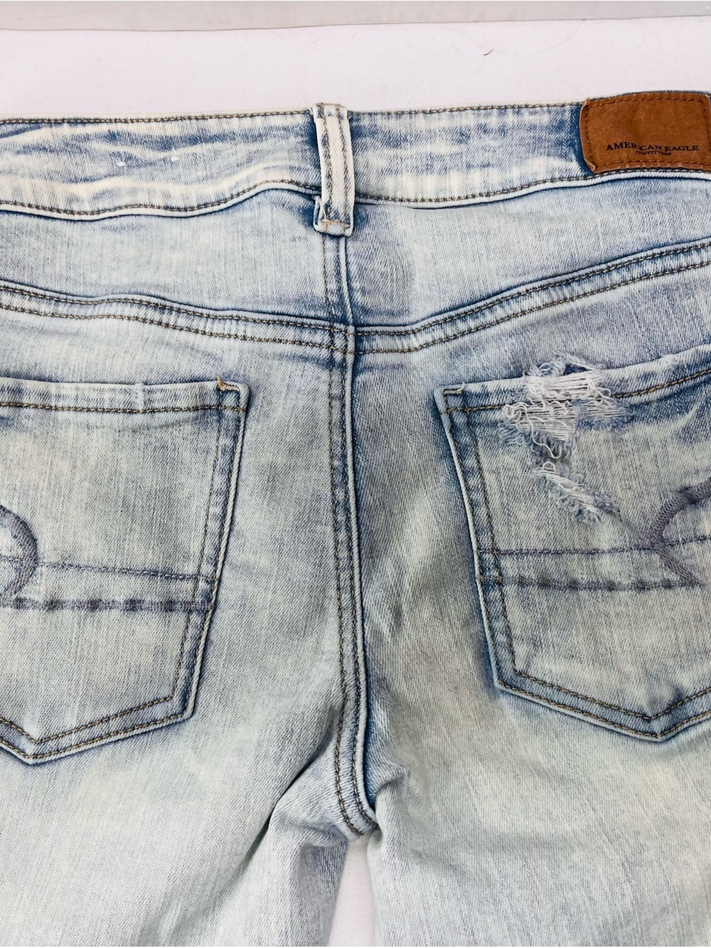 American Eagle Outfitters Light Blue Skinny Jeans with Back Pocket Distress